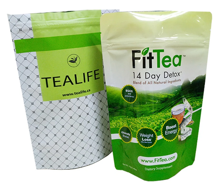 Two printed stand-up pouches labeled TEALIFE and FitTea 14 Day Detox on white background