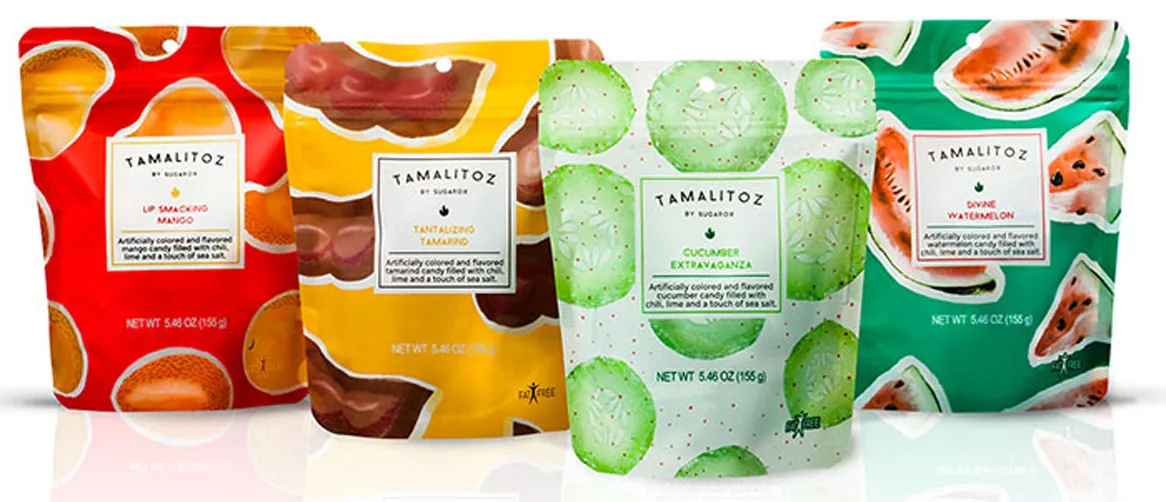 Four colorful Tamalitoz candy pouches with fruit designs lined up on white background