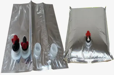 Two silver foil bag-in-box liners with red and white dispensing taps on white background