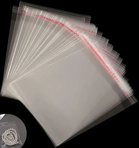 Clear self-seal plastic bags fanned on black background with inset showing bracelet in bag