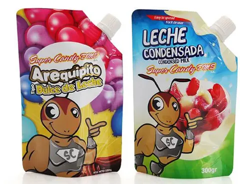 Two colorful spouted pouches of dulce de leche and condensed milk with cartoon ant