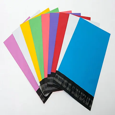 Fanned colorful poly mailer bags with black seals on white background