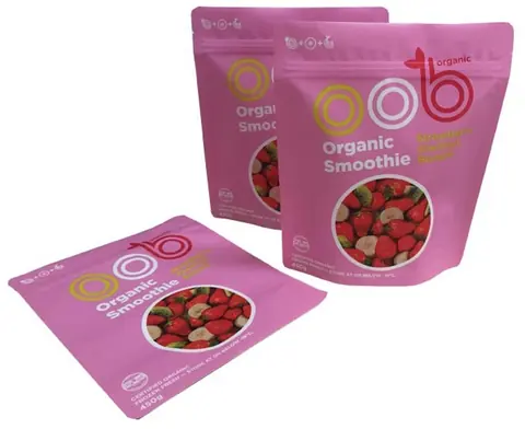 Three pink organic smoothie stand-up pouches with strawberry image on white background