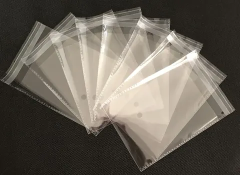 Clear plastic resealable bags fanned out on dark surface