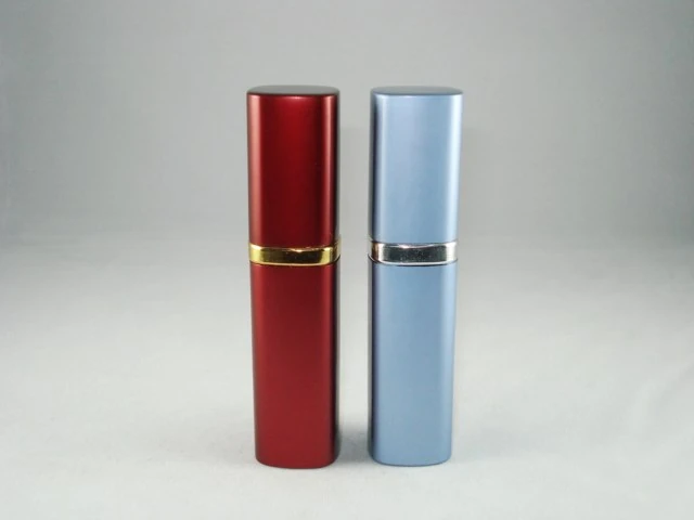 Two rectangular containers, one red with a gold band and one blue with a silver band, on a white background.
