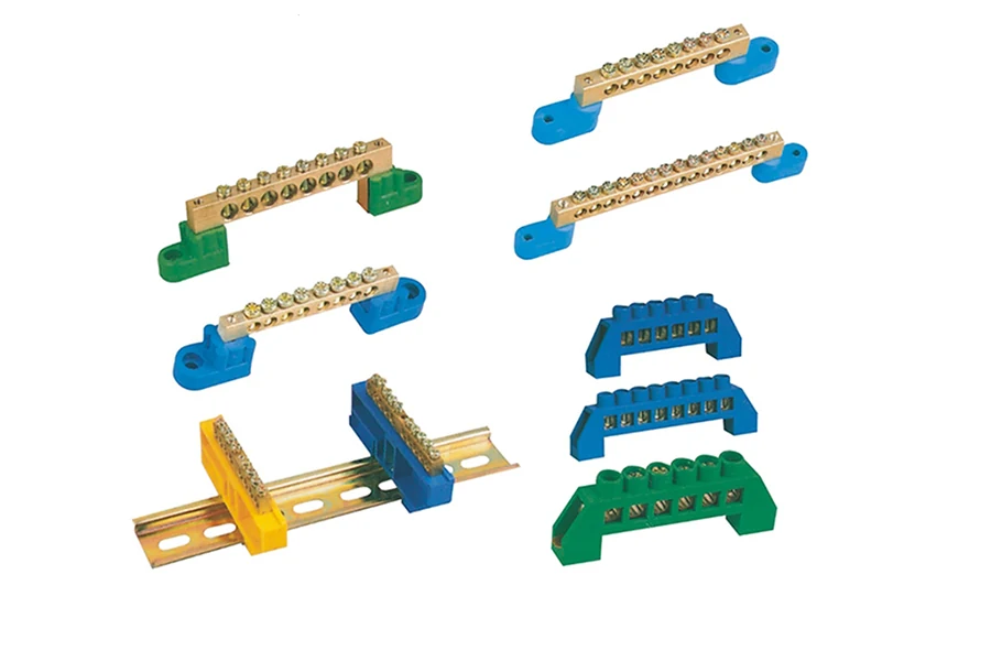 Close-up of a brass neutral link bus bar showing its solid construction and mounting holes