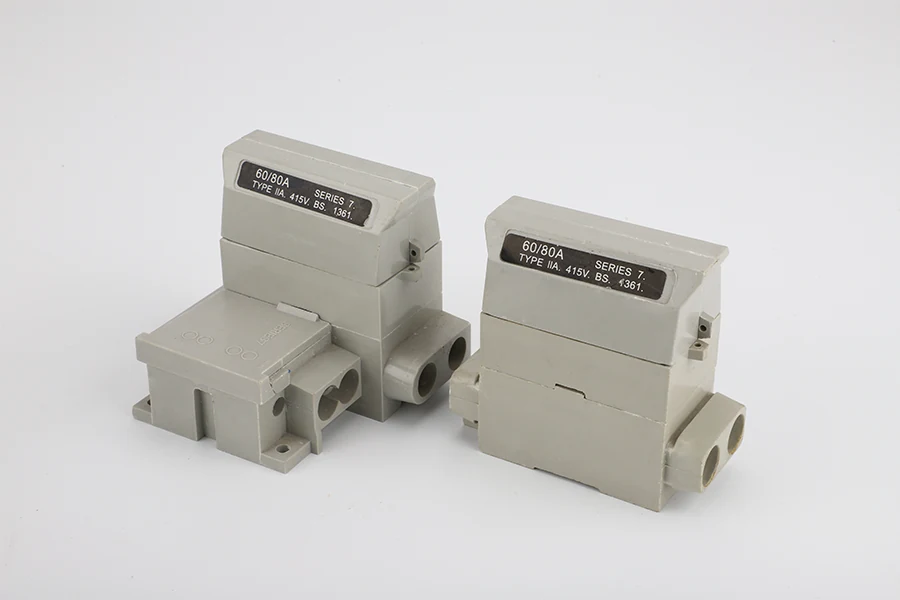 Side view of the cut out fuse showing the terminal connections and compression springs