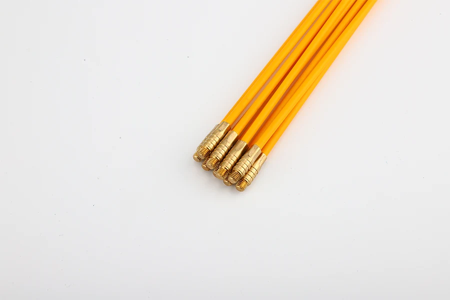 Close-up of threaded brass connector joining two fiberglass rods with acrylic connection