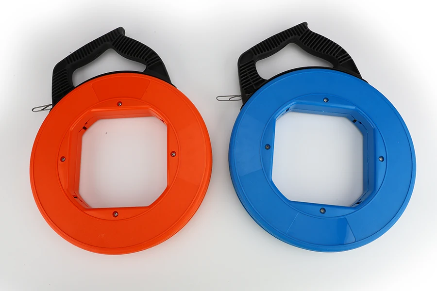 Steel fish tape laid out straight, showing the rigid body and flexible tip