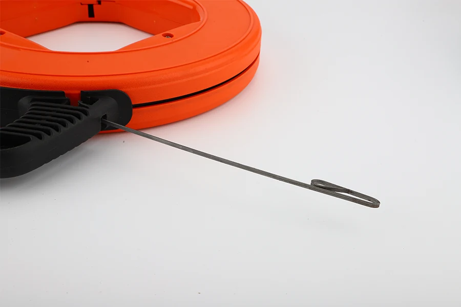 Steel fish tape with a flexible steel tip and coiled body, viewed from the side
