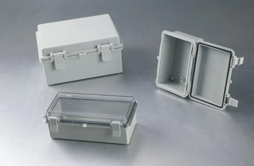 KG series waterproof junction box with screw-on cover and gasket, mounted on a wall