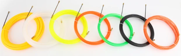 Nylon cable puller tape being fed into electrical conduit