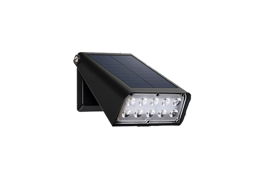 Solar wall light mounted on a wall, with solar panel facing upward and light housing in white plastic