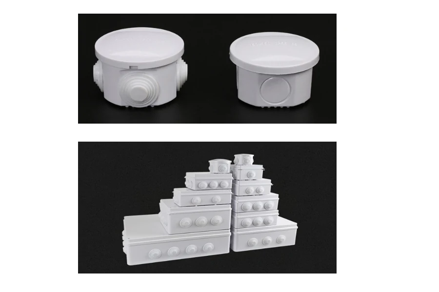 Plastic waterproof junction box with sealed lid, shown in a natural outdoor setting