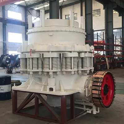 Cone crusher assembly on a stand in a workshop