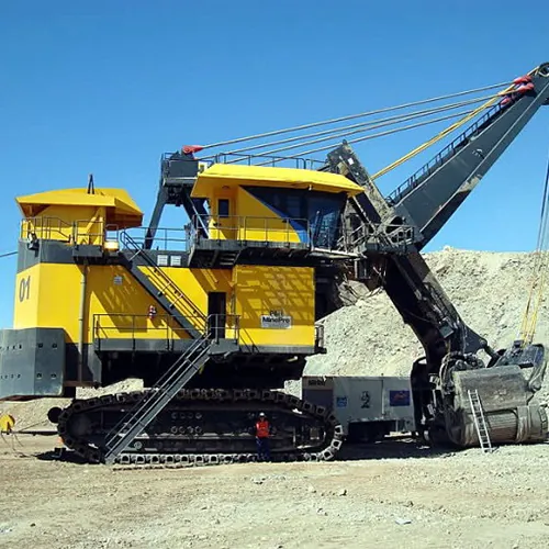Electric rope mining shovel loading in an open pit