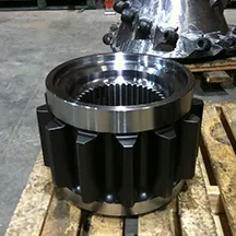 Large machined housing with bolt flange on a shipping pallet