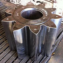 Cut tooth pinion for a mining shovel gear train