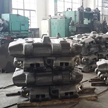 Cast crawler shoes stacked in a workshop