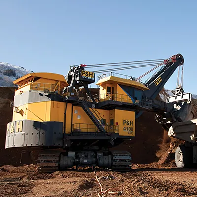 P&H electric rope shovel loading a haul truck at a mine face