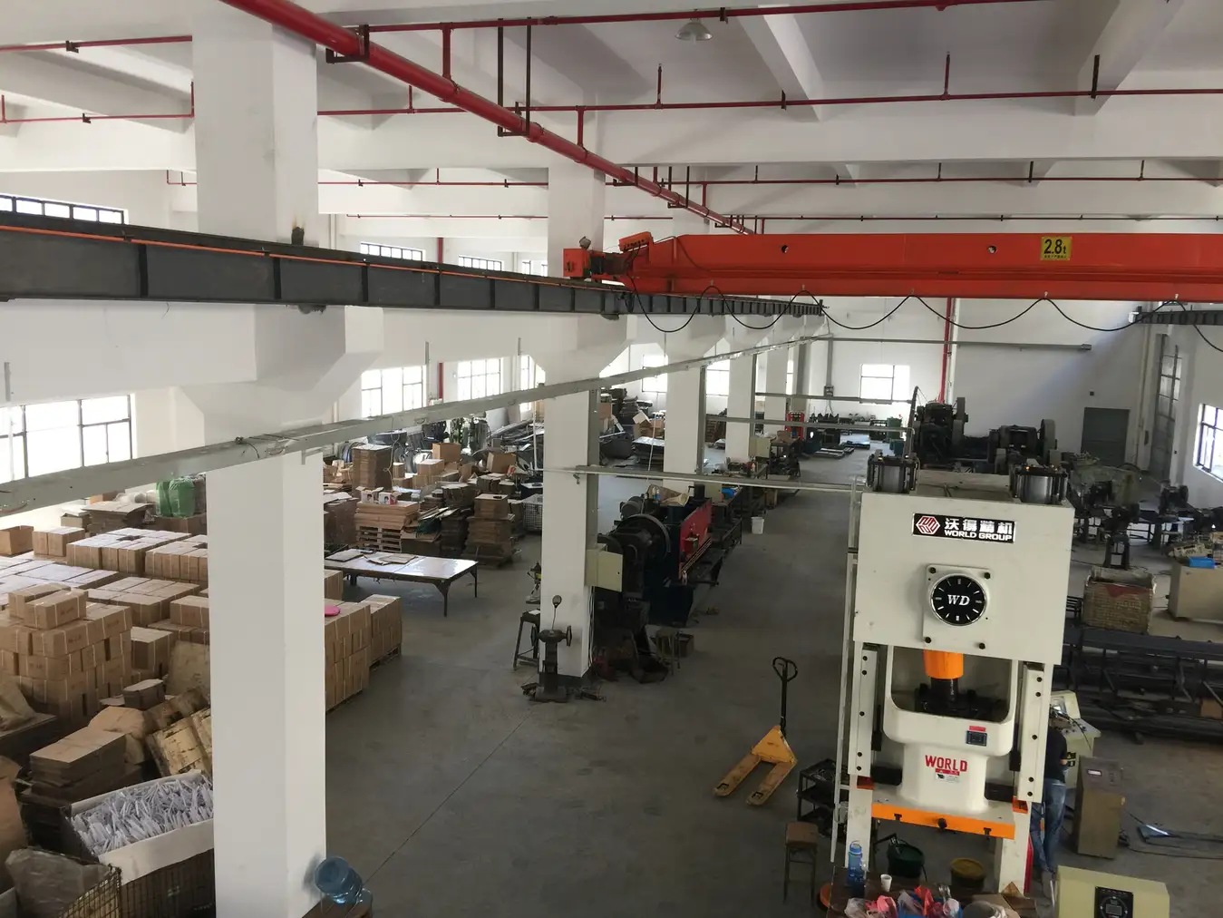 Stamping press shop with mechanical presses overhead crane and packed cartons