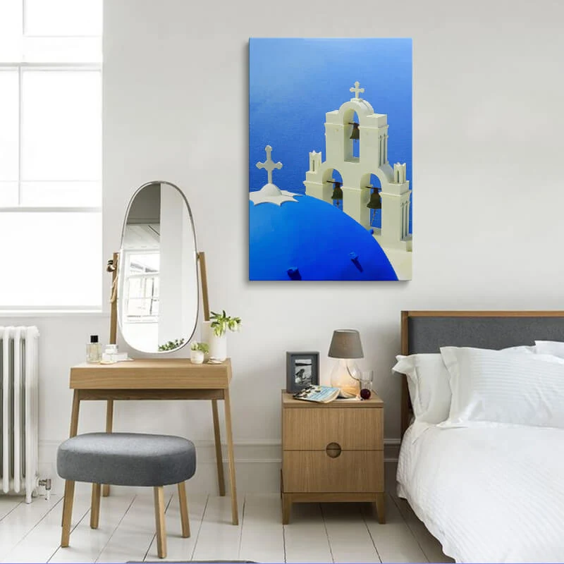 Agios Theodori Church canvas hung in a bedroom above a bedside table
