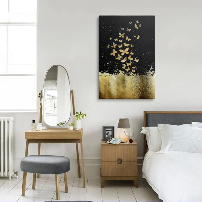 Black Gold Butterflies canvas hung in a bedroom above a bedside table