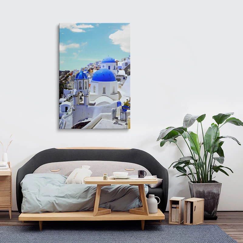 Blue Dome Church Santorini canvas hung above a sofa in a lounge