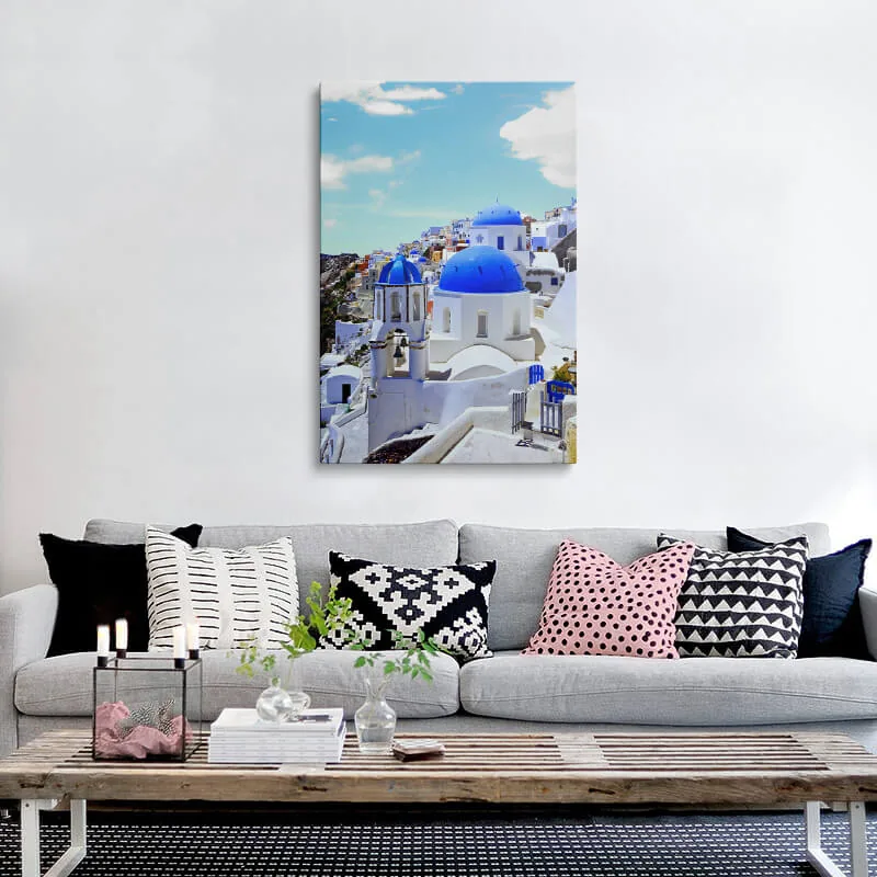 Blue Dome Church Santorini canvas hung above a sofa in a living room