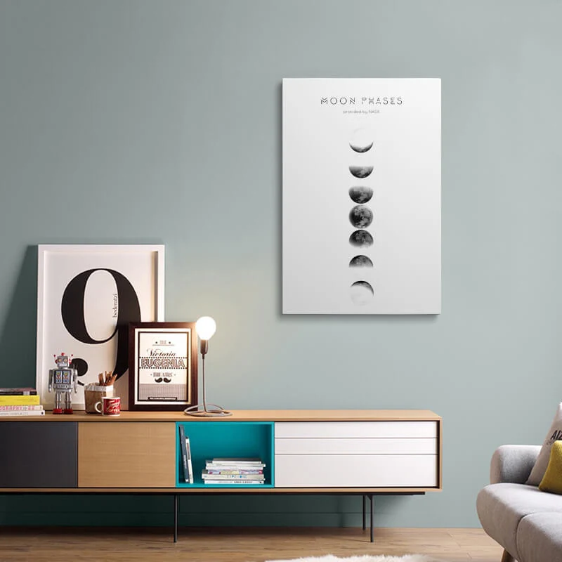 Moon Phase Photo canvas hung above a sideboard in a living room