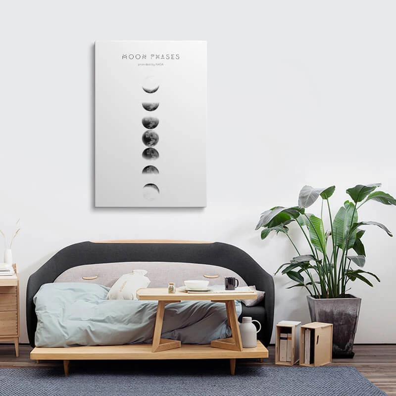 Moon Phase Photo canvas hung above a sofa in a lounge