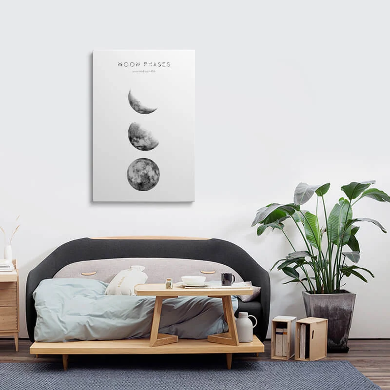 Moon Phases Picture canvas hung above a sofa in a lounge