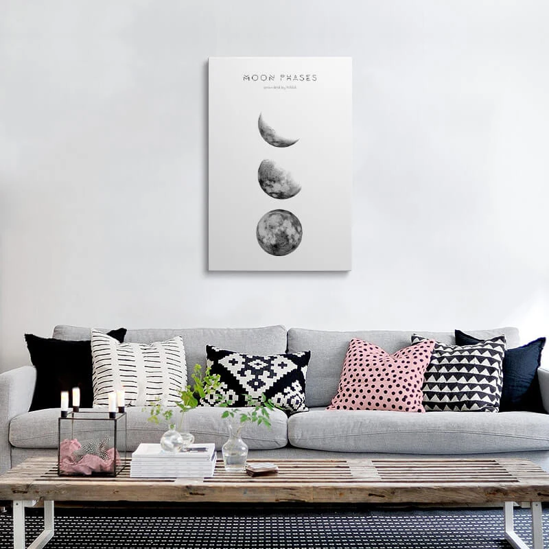 Moon Phases Picture canvas hung above a sofa in a living room