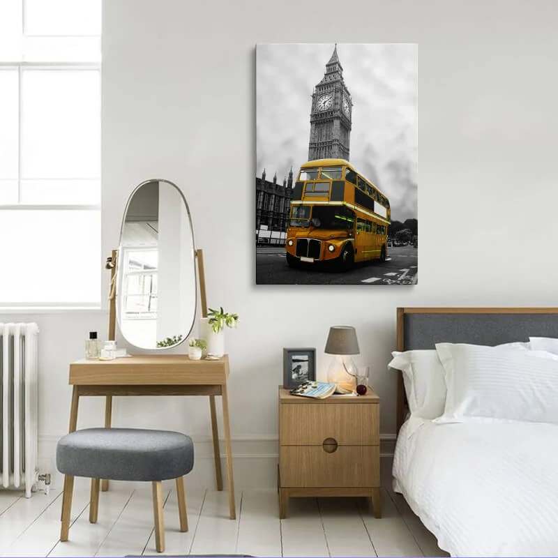 Orange London Bus canvas hung above a sofa in a lounge