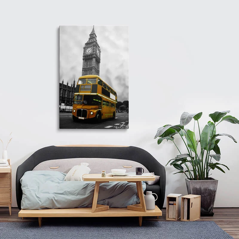 Orange London Bus canvas hung in a bedroom above a bedside table