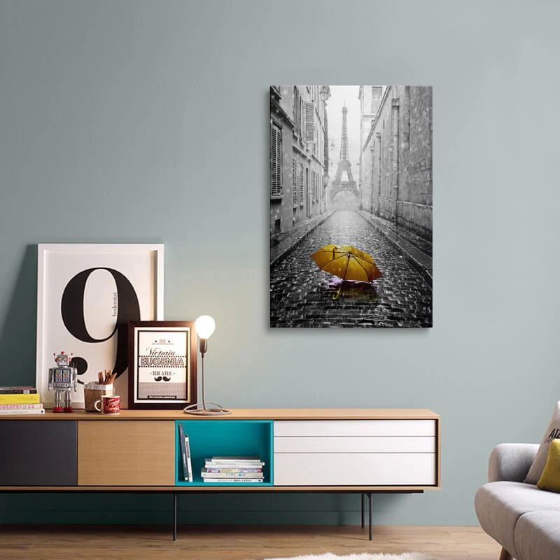 Orange Umbrella Eiffel Tower canvas hung above a sideboard in a living room