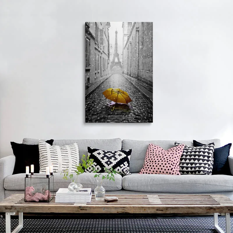 Orange Umbrella Eiffel Tower canvas hung above a sofa in a living room
