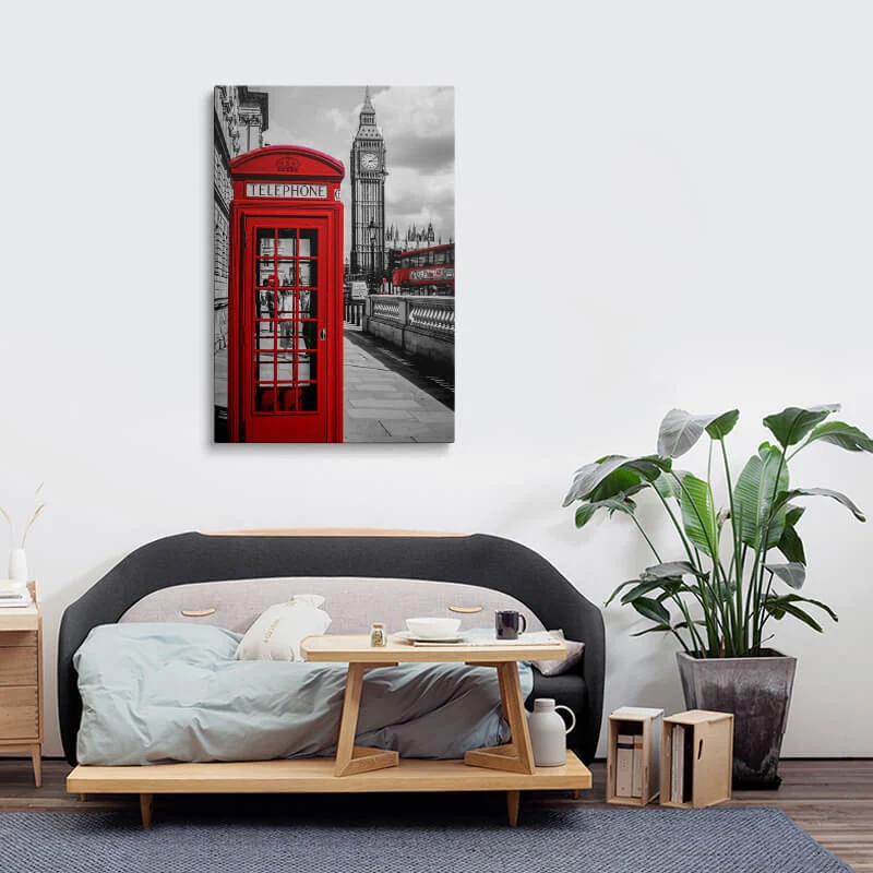Red London Telephone Box canvas hung above a sofa in a lounge