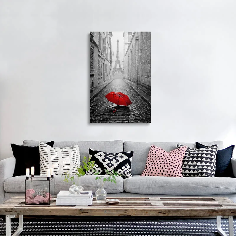 Red Umbrella Eiffel Tower canvas hung above a sofa in a living room