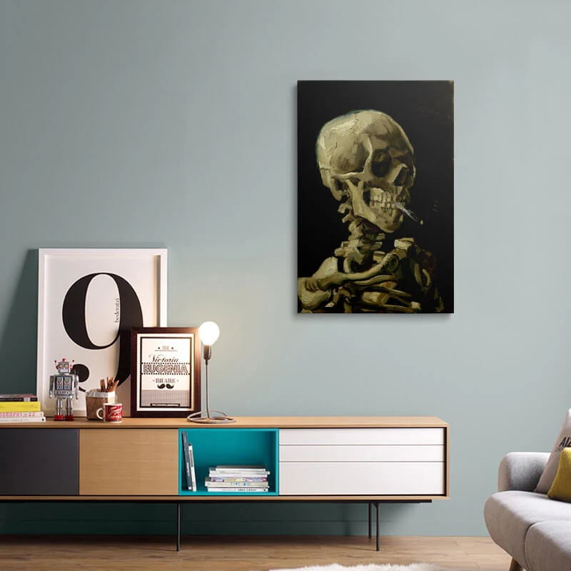 Skull Of A Skeleton With Burning Cigarette canvas hung above a sideboard in a living room