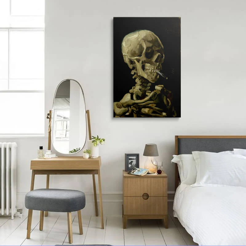 Skull Of A Skeleton With Burning Cigarette canvas hung in a bedroom above a bedside table
