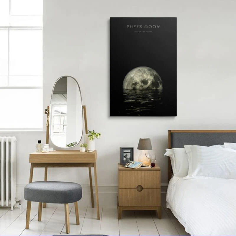 Super Moon On The Water canvas hung in a bedroom above a bedside table