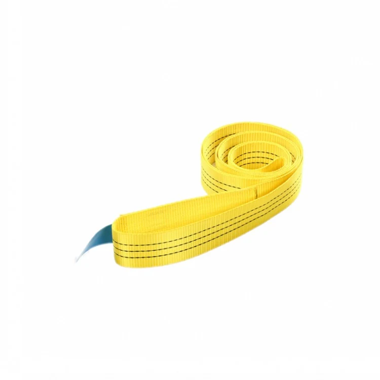 Yellow webbing lifting sling coiled with a blue protective sleeve at one end on a white background