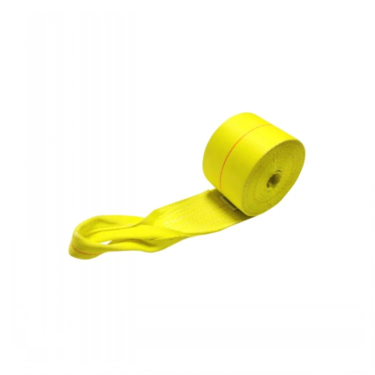 Coiled yellow webbing lifting sling with a reinforced eye loop on a plain white background