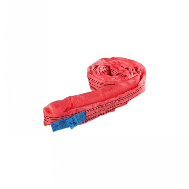 Coiled red round lifting sling with blue identification tags on a white background