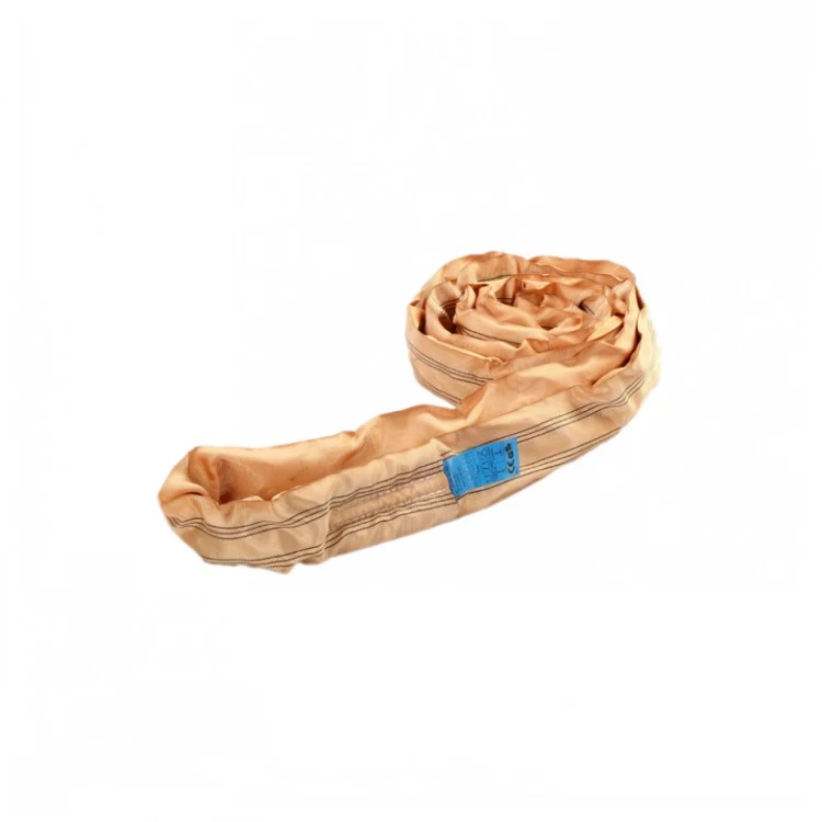 Coiled beige polyester round lifting sling with blue identification tag on a plain white background