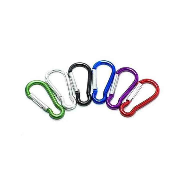 Six aluminum carabiner snap hooks in green, silver, black, blue, purple, and red fanned out on a white background