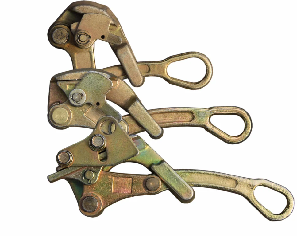 Three metal wire rope pulling clamps with lever handles and eye loop ends on a white background