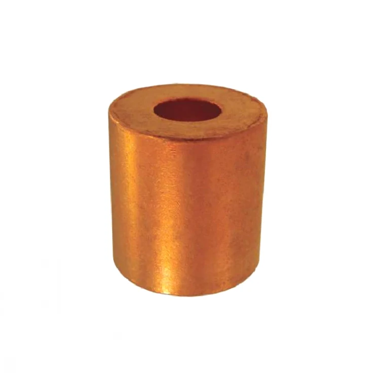 Copper cylindrical spacer bushing with central bore on a plain white background