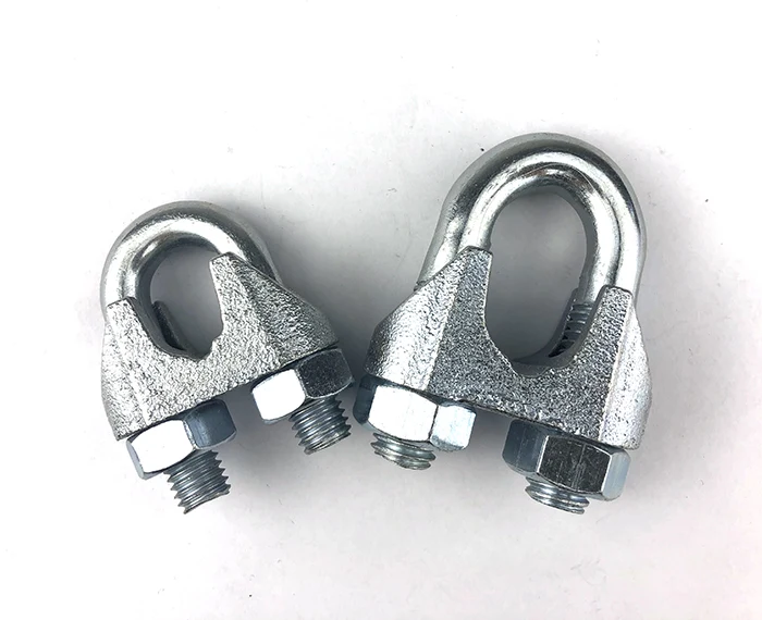 Two galvanized steel wire rope clips with U-bolts, saddles and hex nuts on a plain white background